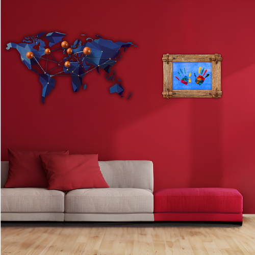 Living room with red wall, world map, and framed artwork.