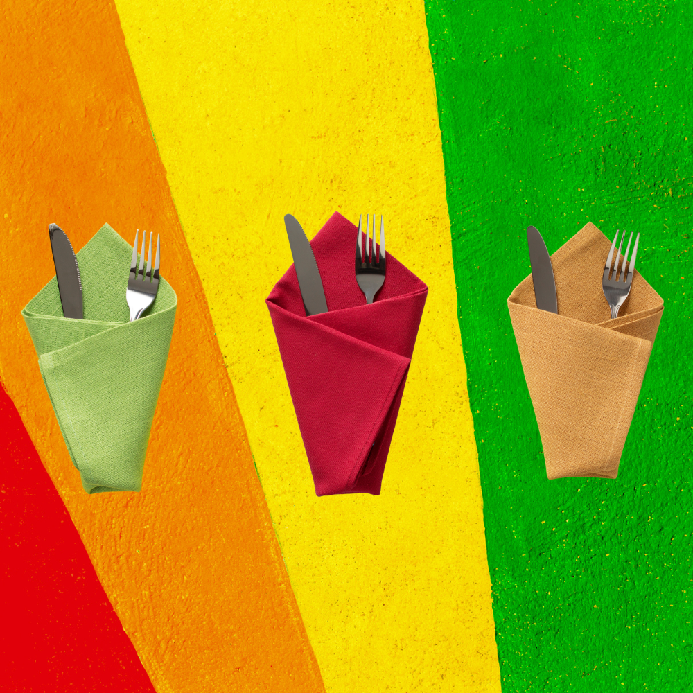 Three folded napkins with cutlery on a colorful striped background