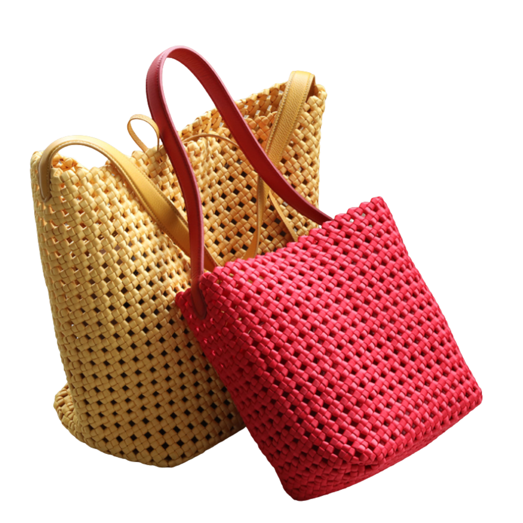 Two woven bags, one yellow and one red, on a white background