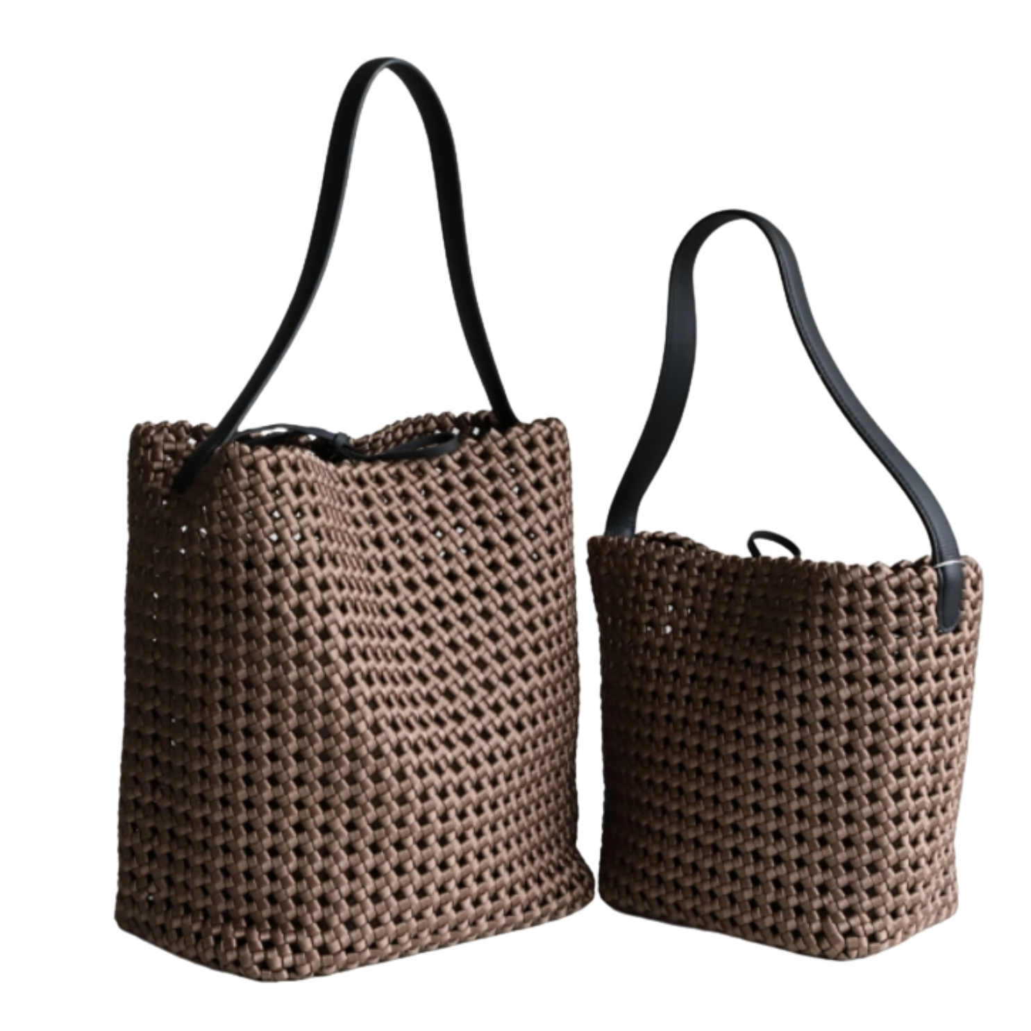 Two brown woven handbags with black straps on a white background